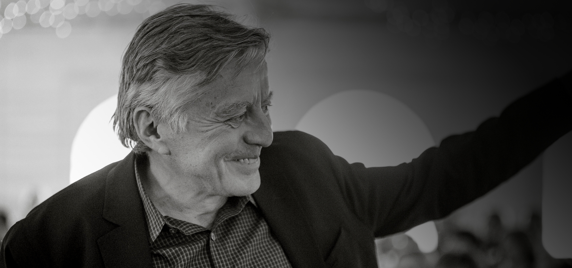 A side profile black and white portrait of Mac Van Wielingen.